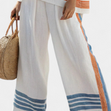 Conjunto Étnico de Margaridas em branco com detalhes em azul e laranja – estilo único e vibrante