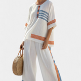 Conjunto Étnico de Margaridas em branco com detalhes em azul e laranja – estilo único e vibrante